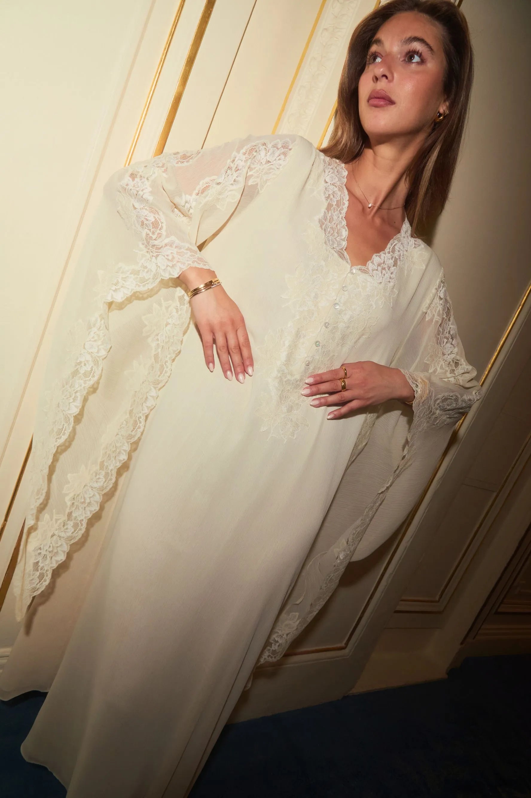 Close-up of lightweight chiffon fabric and sleeve detail on honey-colored dress