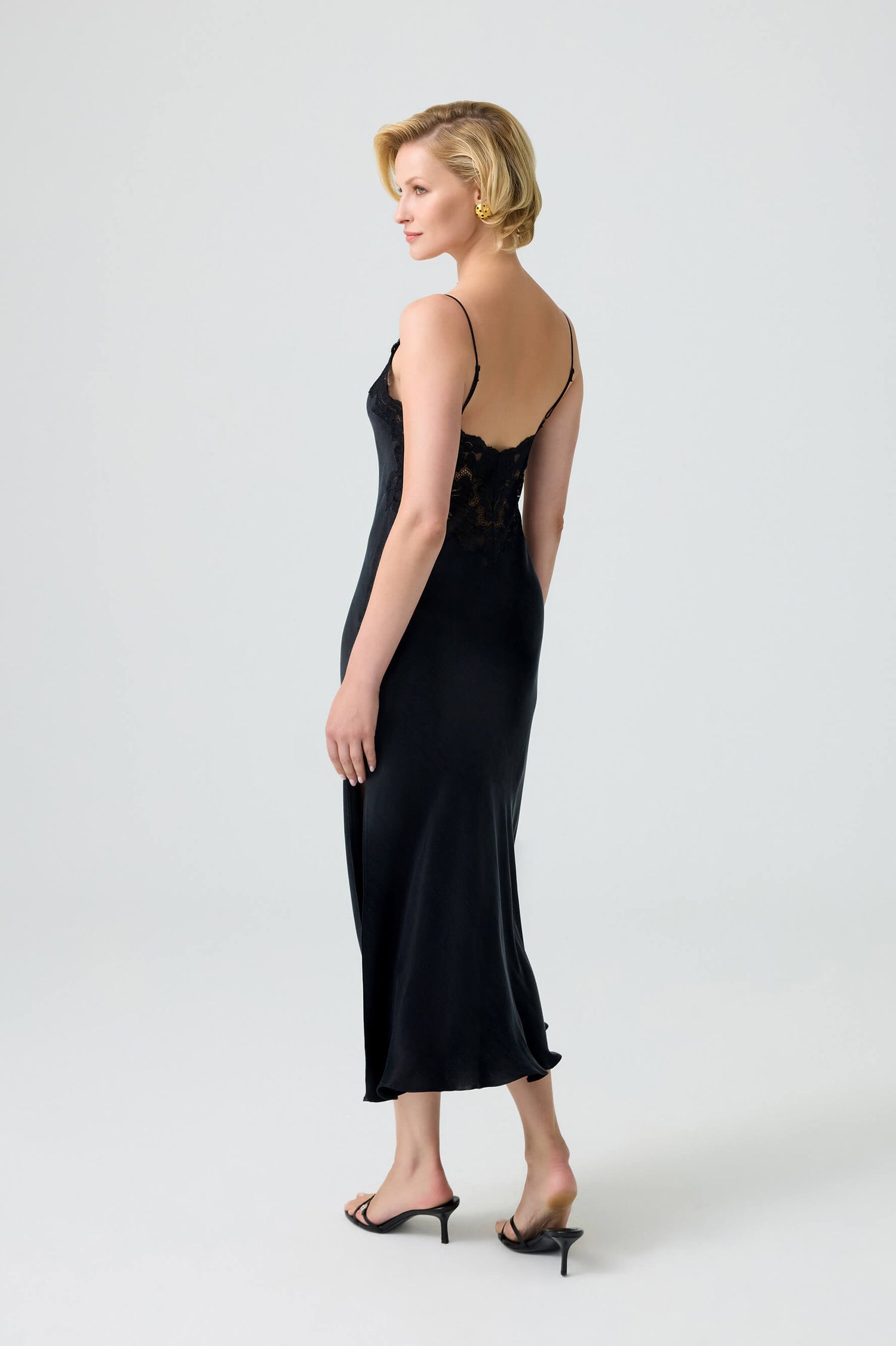 silk inner dress A whisper of silk beneath a veil of sheer softness. The fluid inner gown gently skims the body, while the airy outer layer drapes with poetic ease, creating movement with