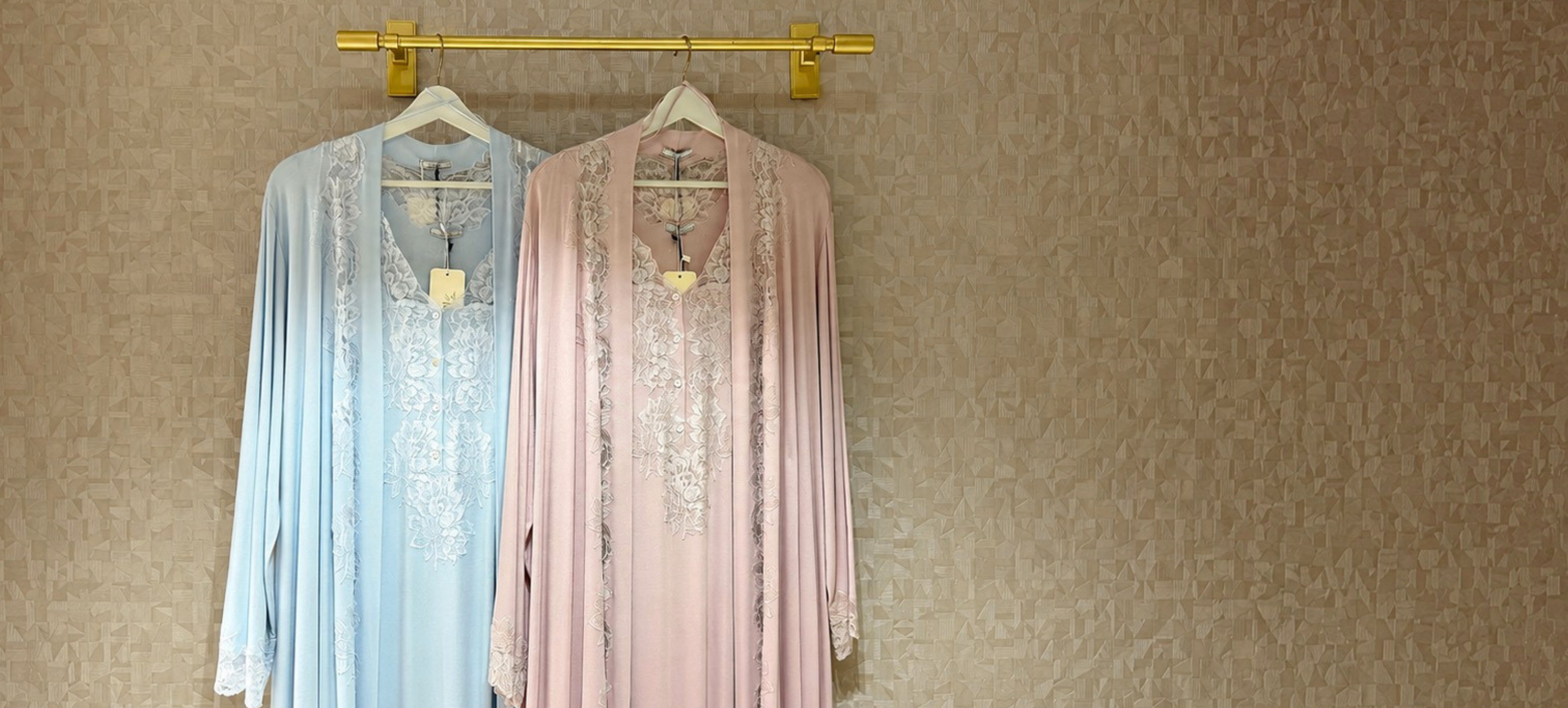 Luxury cotton robes hanging together in an elegant collection display
