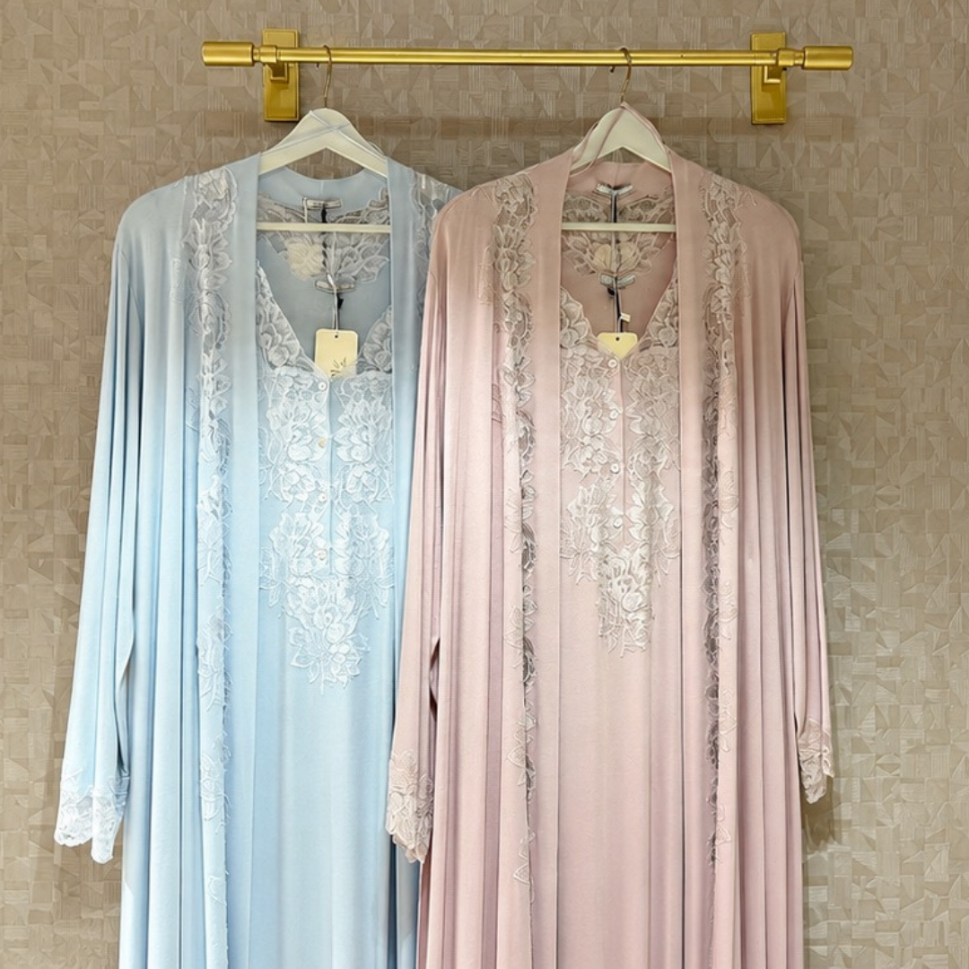 Premium cotton robes suspended on hangers showcasing soft, relaxed silhouettes