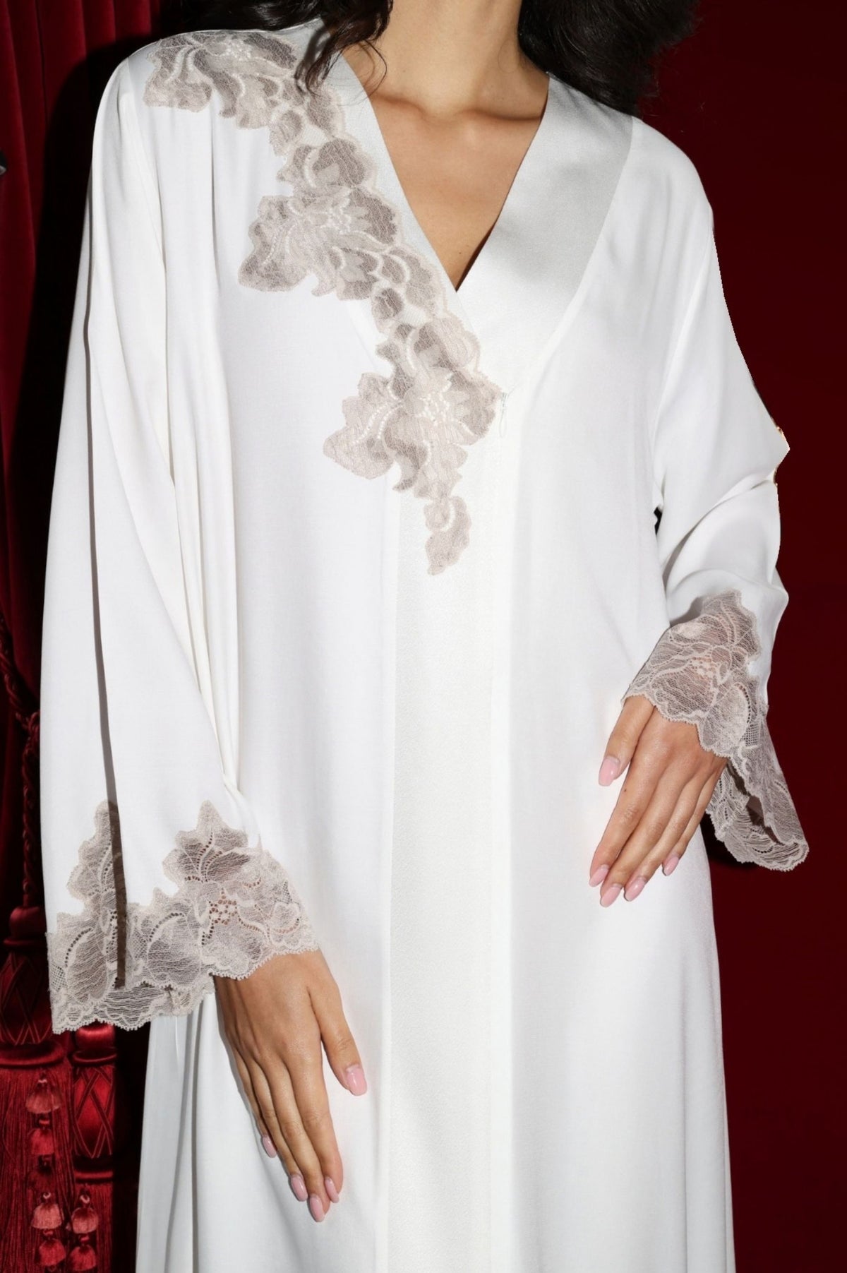 Beautiful woman wearing a white dress with brown lace details from The Art of Her collection launched by Bocan