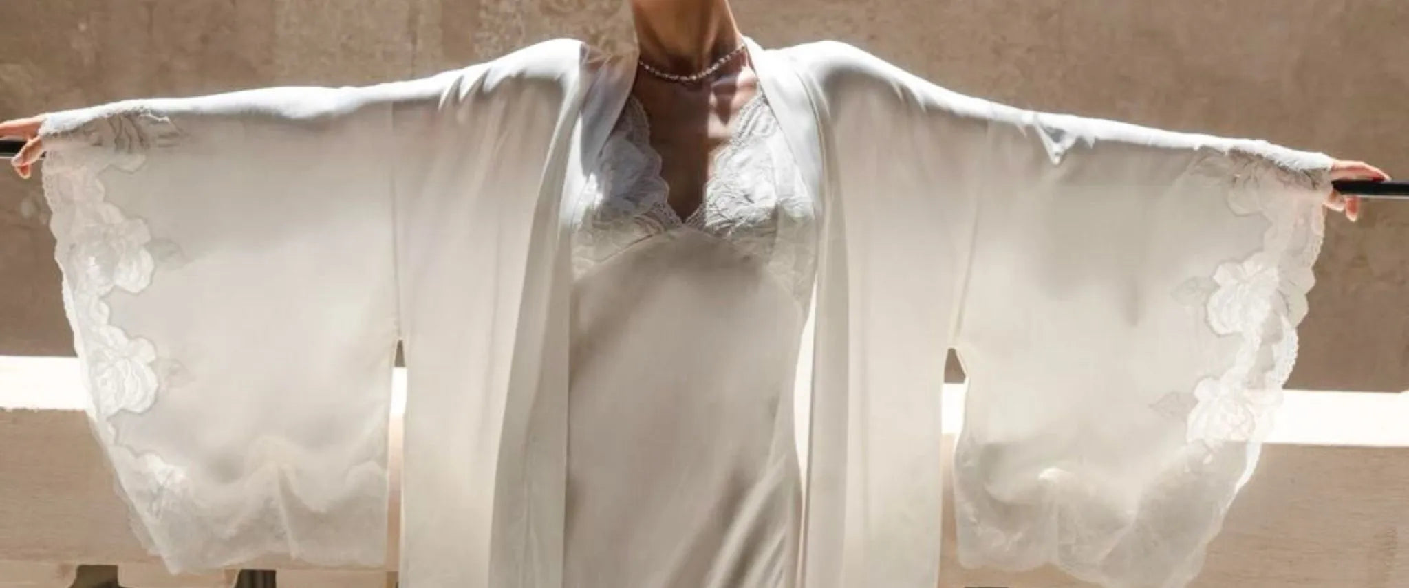 Elegant bridal robe collection crafted in lace and silk for a timeless wedding morning look